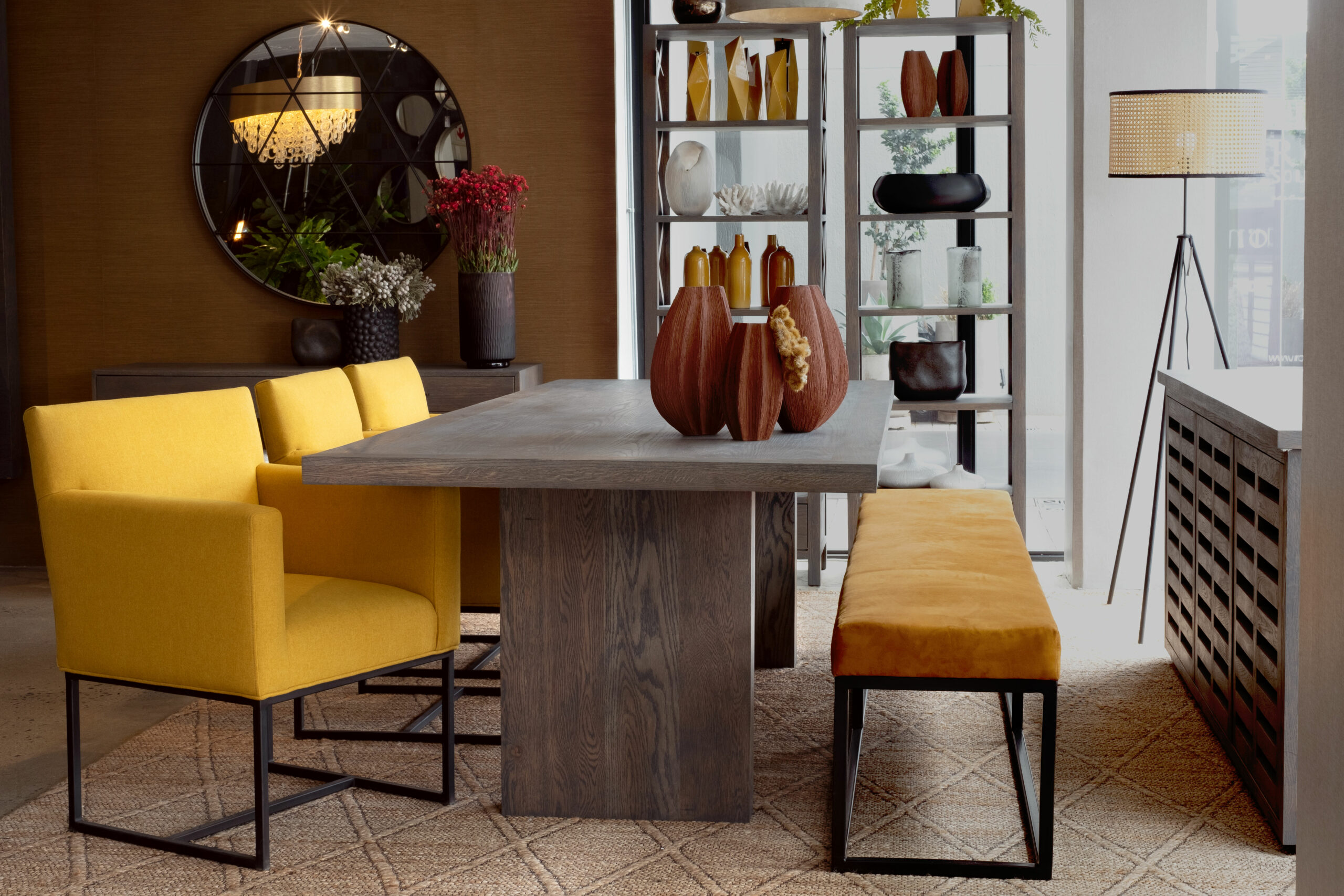 FAQ's Questions? We're here to help Beautiful dining room table with wood finishes and matching sideboard paired with sunshine yellow chairs and a mustard bench