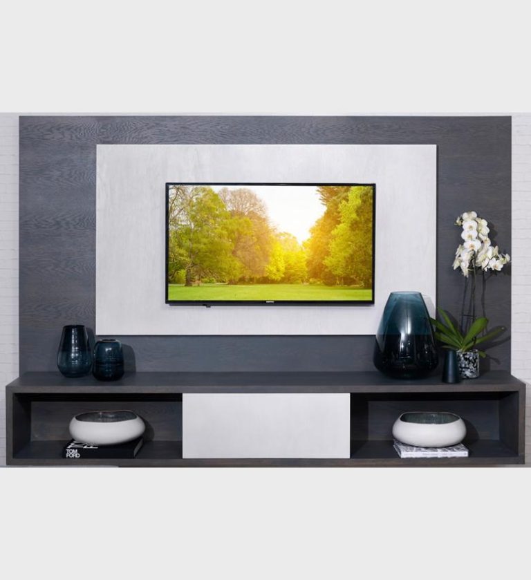 The Floating AV Wall Unit is a sophisticated centerpiece for modern living spaces, combining architectural precision with functional elegance. Its layered design features a broad dark‑wood frame surrounding a lighter inset panel