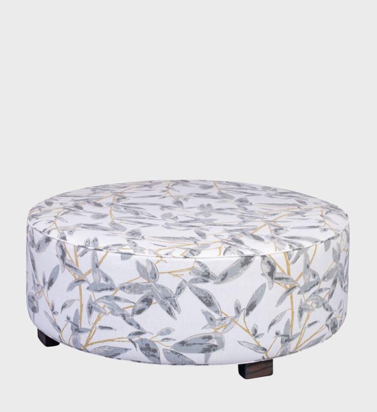 The Cloud Ottoman brings a touch of nature indoors with its soft botanical print in grey and gold tones. Upholstered in a smooth fabric with a circular silhouette