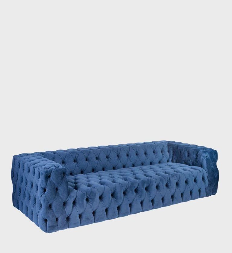 The Kravitz Sofa is a bold reinterpretation of classic tufted luxury. Upholstered in rich cognac‑brown leather, it features deep diamond buttoning across its low, structured frame