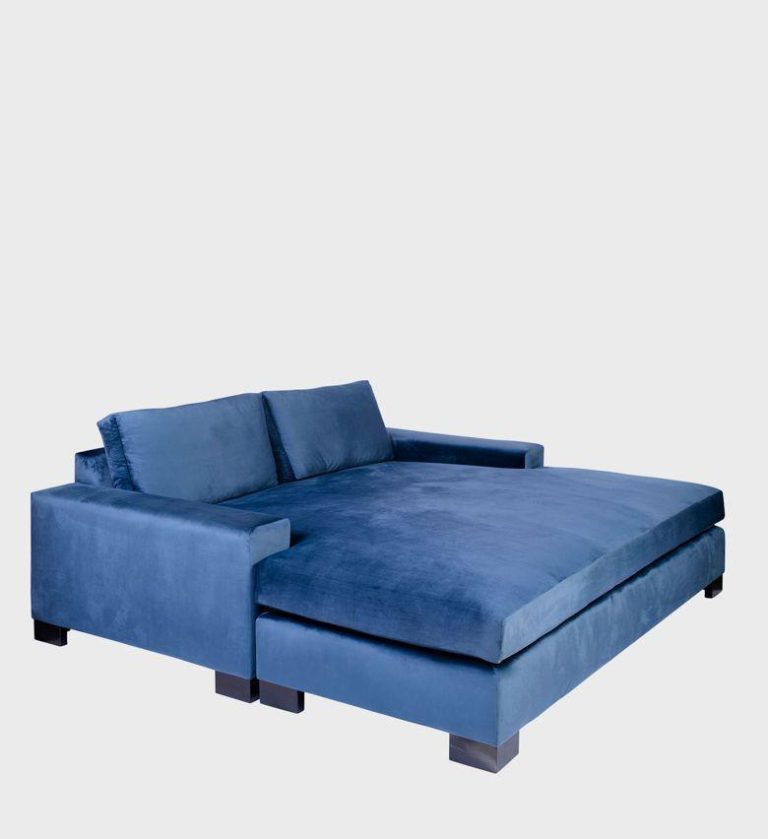 The Hampton Daybed embodies contemporary comfort with its generous proportions and deep charcoal upholstery.