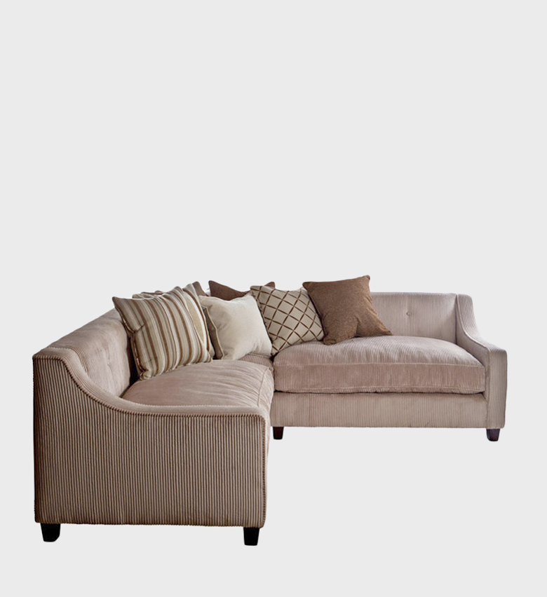 The Lamorena Corner Unit is a plush sectional sofa that blends comfort with casual sophistication. Upholstered in soft beige corduroy, it features gently curved arms and deep seating