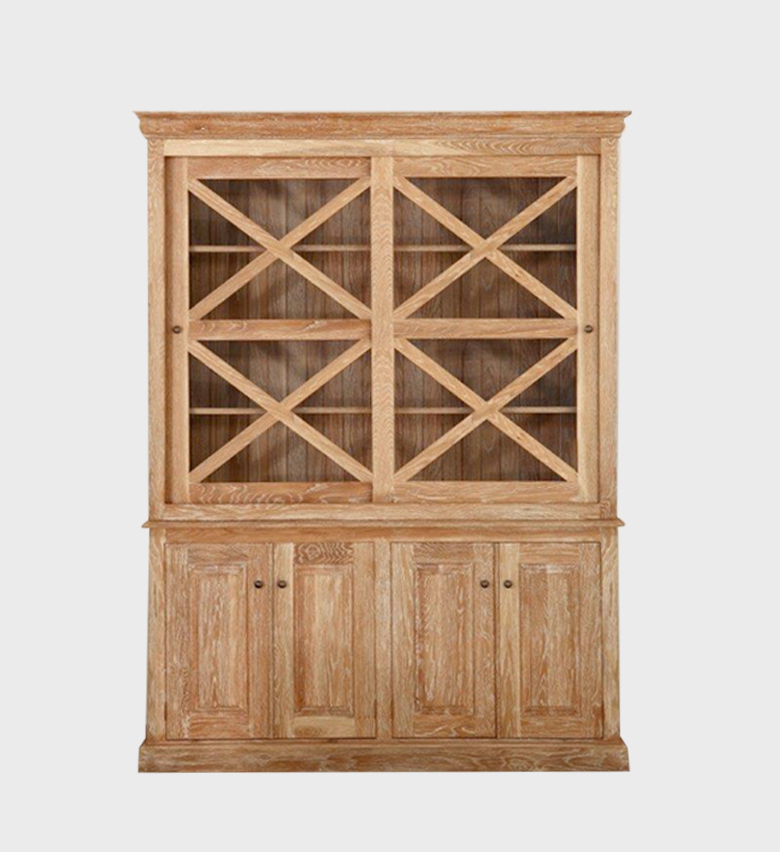 The Sapperton X Fronted Cabinet exudes rustic elegance with its light oak finish and distinctive cross‑paneled glass doors. Combining open display shelving above with enclosed storage below, it balances charm and practicality.