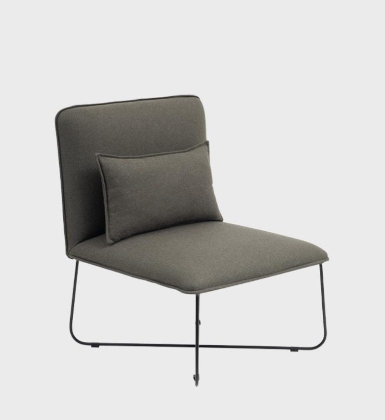 The Palma Chair is a striking example of minimalist comfort. Upholstered in a rich terracotta fabric, it features a sleek silhouette with a gently reclined back and a matching lumbar cushion for ergonomic support.
