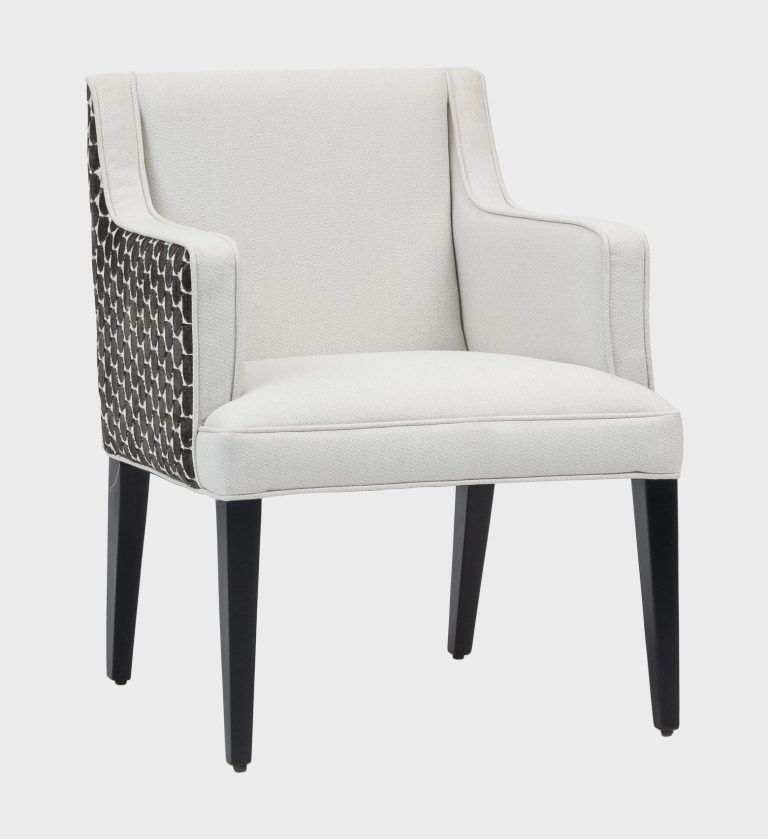 The Cape Dining Chair MD blends timeless elegance with modern craftsmanship. Its crisp ivory upholstery contrasts beautifully with the textured geometric pattern
