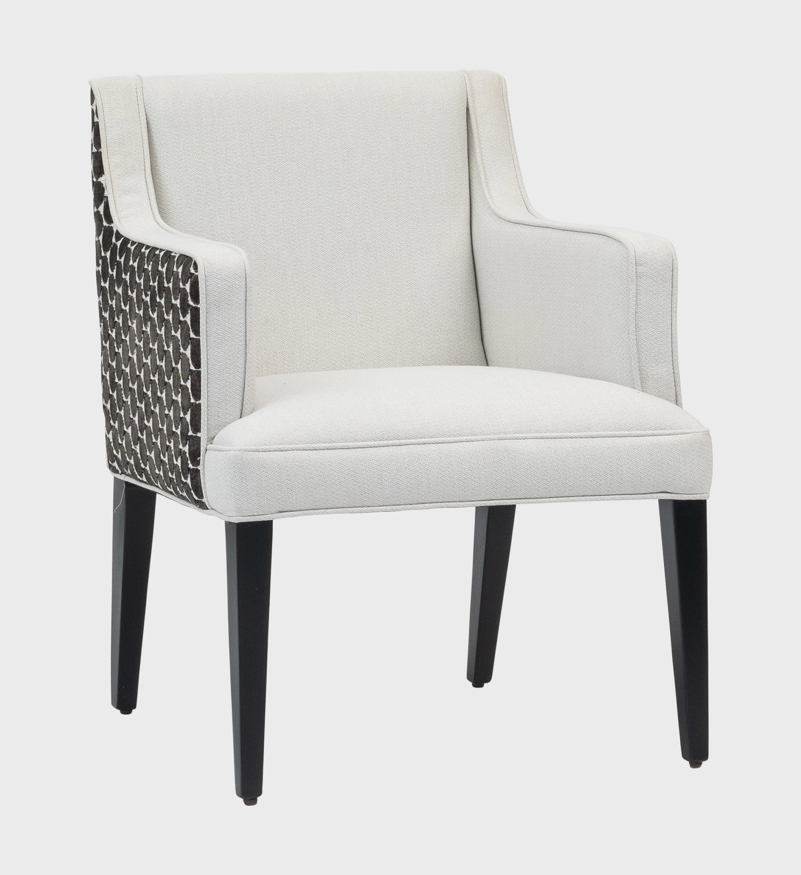 The Cape Dining Chair MD blends timeless elegance with modern craftsmanship. Its crisp ivory upholstery contrasts beautifully with the textured geometric pattern