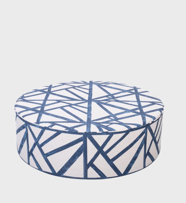 The Cloud Ottoman brings a touch of nature indoors with its soft botanical print in grey and gold tones. Upholstered in a smooth fabric with a circular silhouette