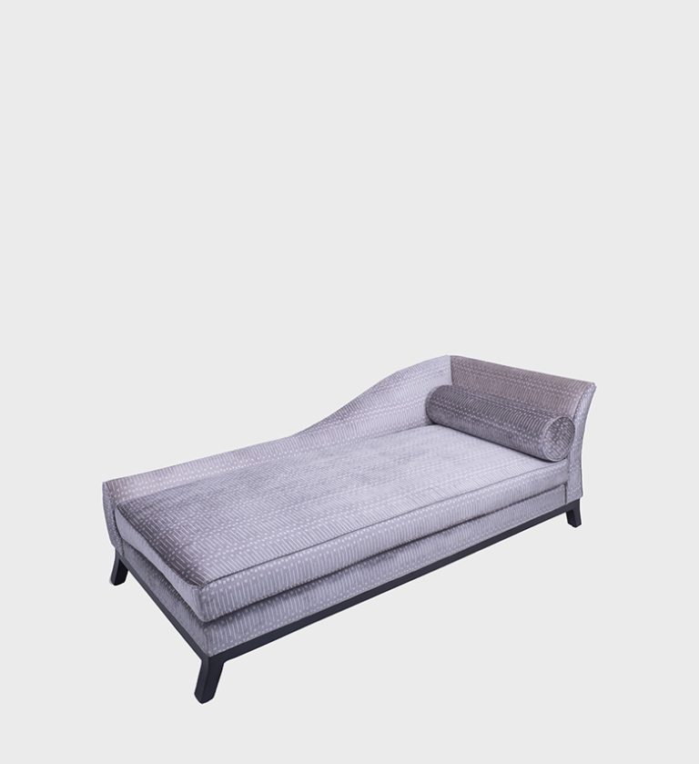 The Diane Daybed captures modern elegance with its sleek silhouette and rich dark‑velvet upholstery. Accented by crisp white piping, its gently curved backrest and cylindrical bolster evoke timeless sophistication.
