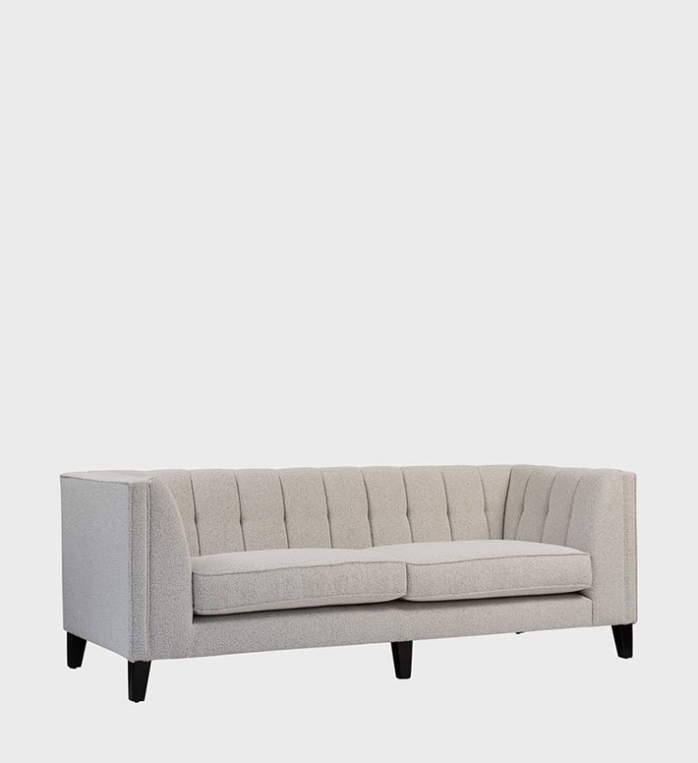 The Gosling Sofa is a modern classic that balances structure and comfort with effortless grace. Upholstered in a soft, light‑textured fabric, it features vertical channel tufting along the back and sides, creating a refined sense of rhythm and depth.