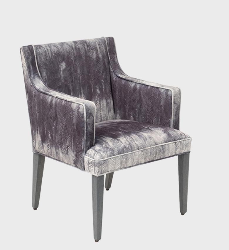 The Cape Dining Chair Storm captures modern elegance with its luxurious patterned upholstery in silvery‑grey tones.