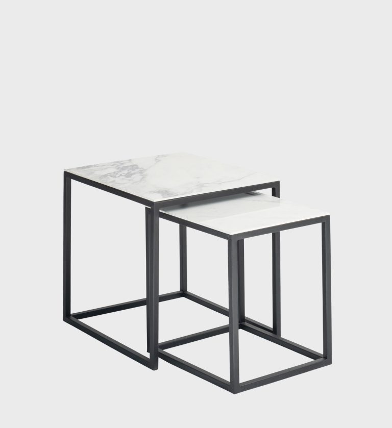 The Nordic Nesting Side Tables embody Scandinavian simplicity with a refined modern edge. Each table features a square white marble top with soft gray veining, supported by slender black metal frames that form clean geometric silhouettes.
