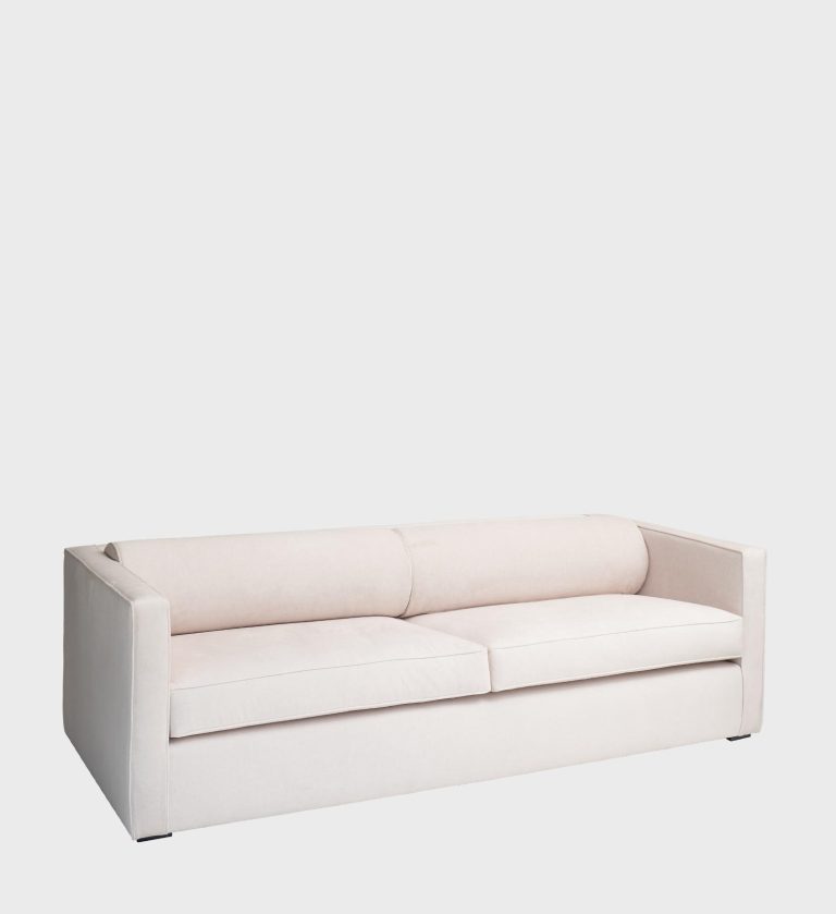 The Sophie Sofa is a refined expression of modern simplicity and comfort. Upholstered in a soft, light‑gray fabric, it features clean lines and a low, structured profile that exudes understated elegance.
