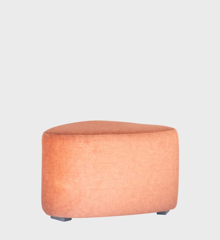 The Pebble Ottoman brings playful elegance to modern interiors with its organic, rounded triangular form and smooth navy upholstery.