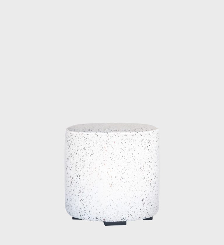The Circle Ottoman offers a minimalist yet luxurious touch with its smooth cylindrical form and rich chestnut‑velvet upholstery.