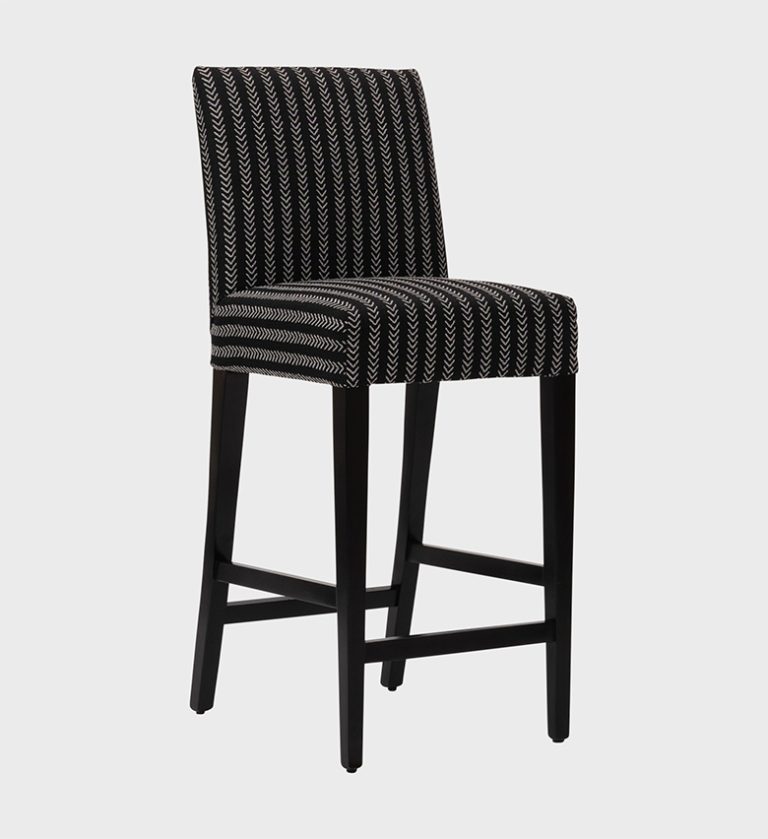 The Cognac Bar Stool MD brings bold pattern and modern comfort together. Upholstered in a striking black‑and‑white chevron fabric