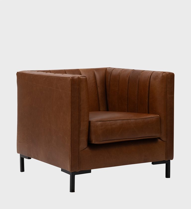 The Nappa Chair embodies sleek modern luxury with its structured silhouette and supple brown leather upholstery.