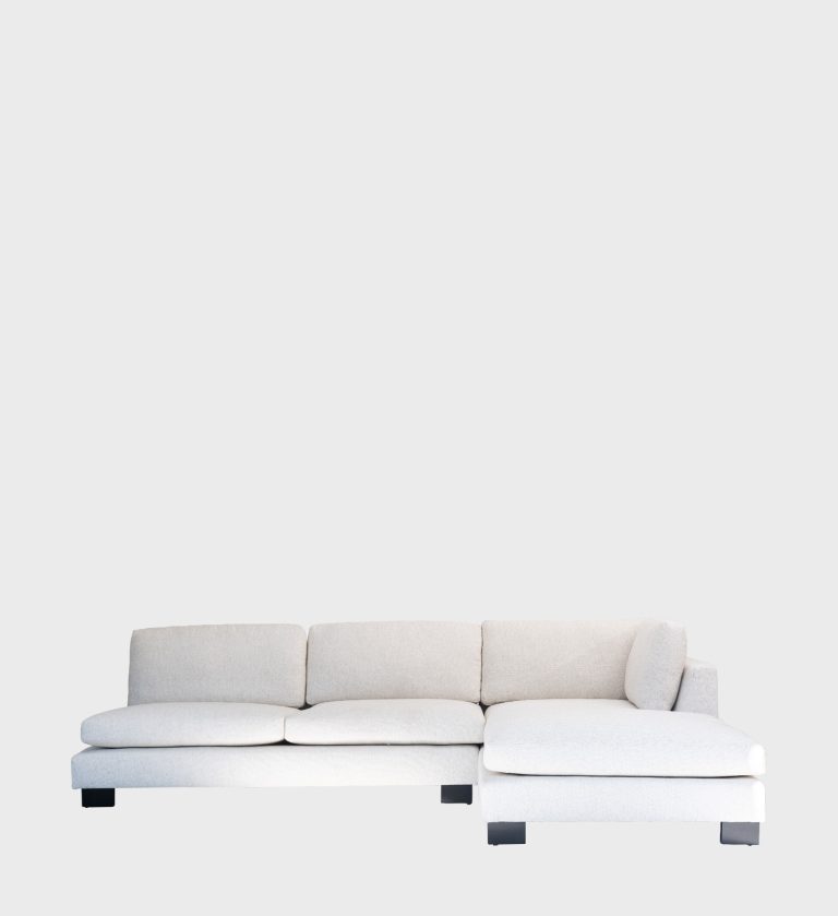The Olivia Daybed embodies effortless modern comfort with its clean lines and soft neutral upholstery. Featuring deep cushions and a right‑hand chaise,