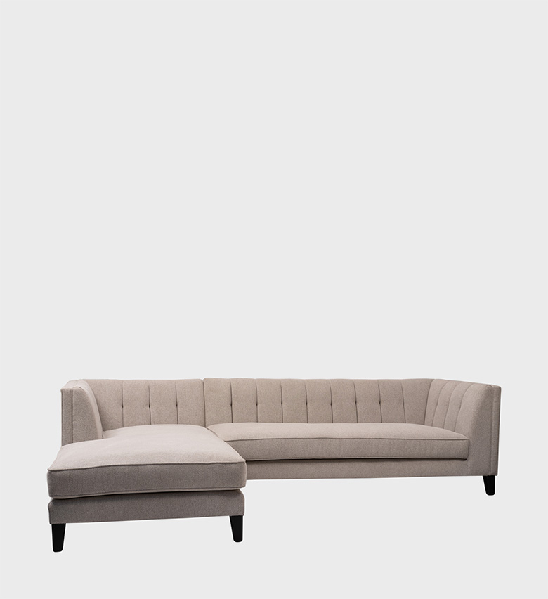 The Gosling Daybed is a refined blend of comfort and architectural elegance. Upholstered in a soft taupe fabric, it features vertical channel tufting along the back and sides, creating a subtle rhythm that enhances its modern silhouette.