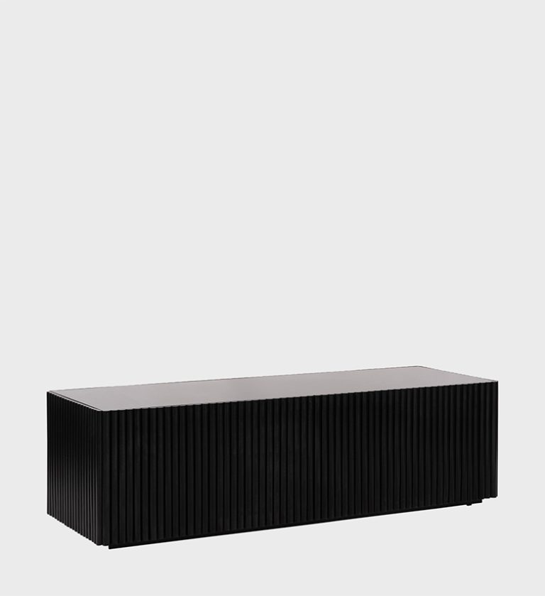 The Rectangular Fluted Coffee Table Ebony is a striking piece that embodies modern sophistication. Its elongated silhouette features vertical fluting along the sides, creating rhythmic texture and architectural depth.