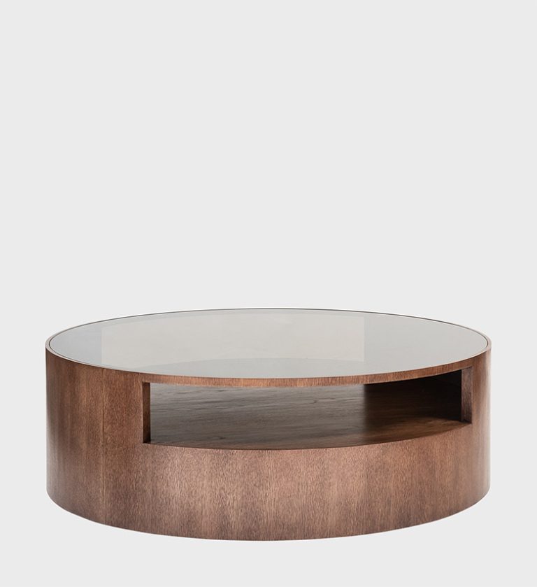 The Kenzo Coffee Table Storm combines refined craftsmanship with functional design. Its circular silhouette features a smoked glass top that adds a soft reflective quality,