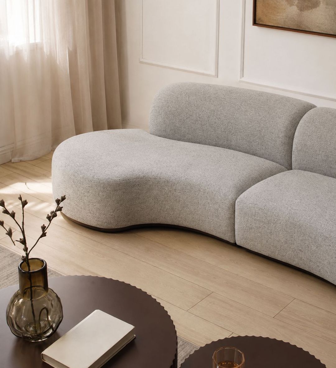 The Noir Sofa is a sculptural centerpiece that embodies organic modernism and refined comfort.