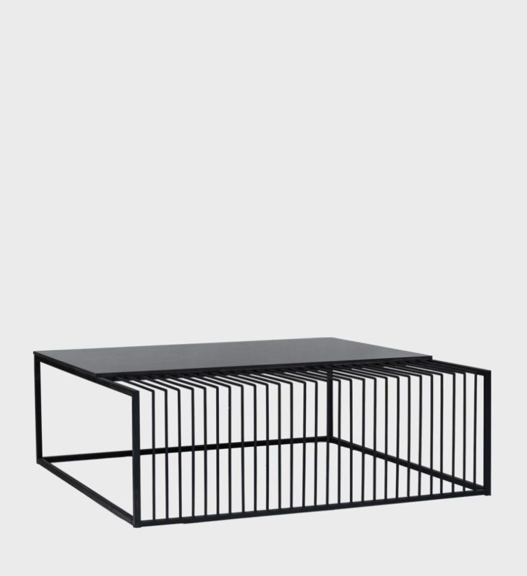 The Latitude Coffee Table is a striking study in contrast and balance. Its rectangular form combines two distinct surfaces — a smooth white marble top and a textured black slatted section