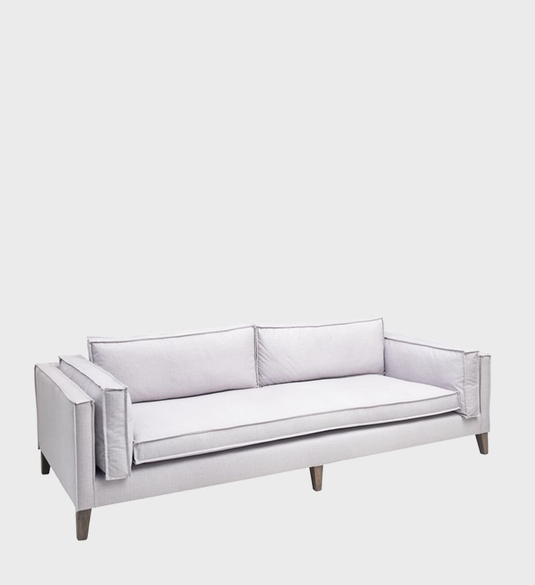 The Chloe Sofa exudes effortless elegance with its clean lines and tailored silhouette. Upholstered in a soft, light fabric, it features deep seat cushions and slim back pillows for a refined yet inviting look.