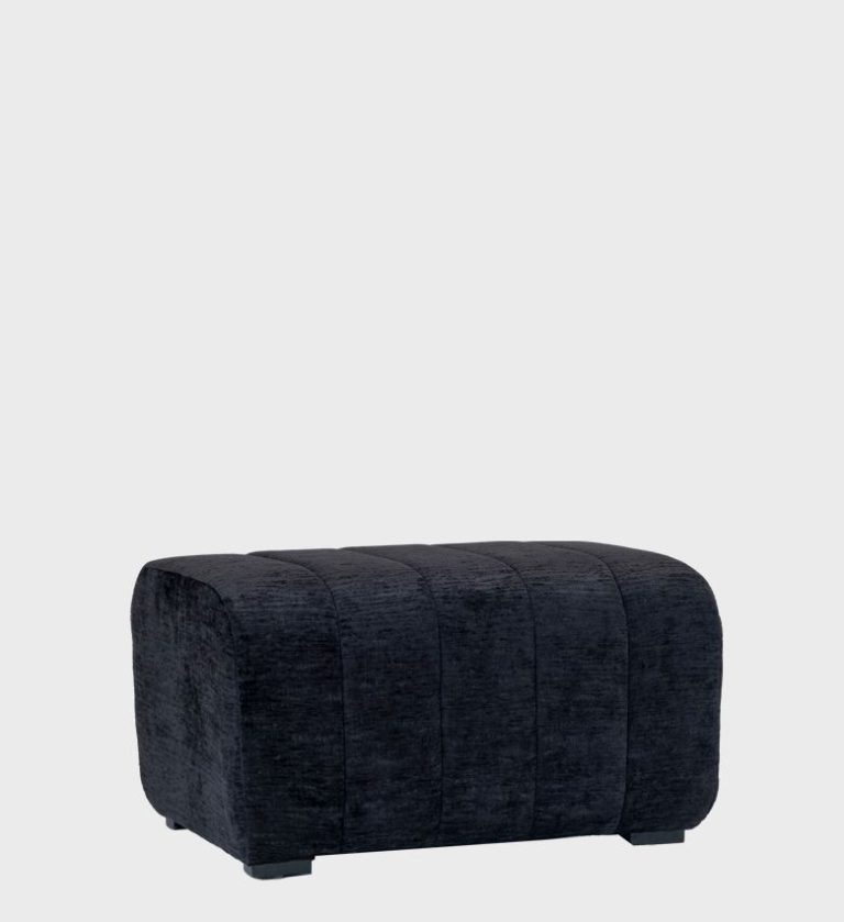 The Sinatra Ottoman brings timeless sophistication to modern interiors. Upholstered in a rich charcoal fabric with vertical stitched panels, its rounded edges and low stance create a sleek, tailored look
