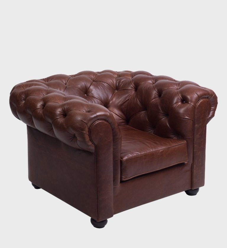 The Chesterfield Armchair is a timeless icon of luxury and craftsmanship. Upholstered in rich brown leather