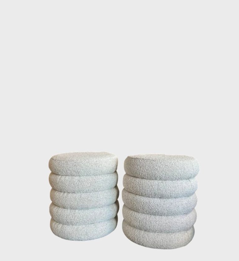 The Ripple Ottoman is a playful yet refined accent piece defined by its sculptural rhythm and plush texture. Each ottoman features stacked, rounded layers upholstered in rich teal velvet with a subtle ribbed pattern that enhances depth and tactility.