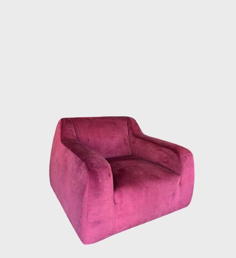 The Riva Arm Chair is a bold expression of comfort and contemporary design. Upholstered in plush magenta velvet, it features a sculptural silhouette with gently curved arms and a deep, inviting seat.